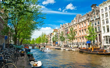 A canal on a sunny day in Amsterdam A canal on a sunny day in Amsterdam